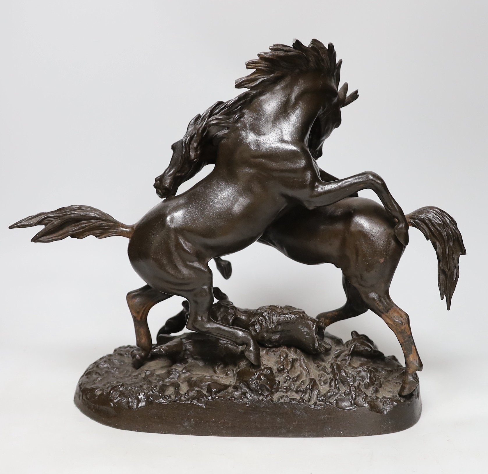 A bronzed cast iron horse group, 35cms high